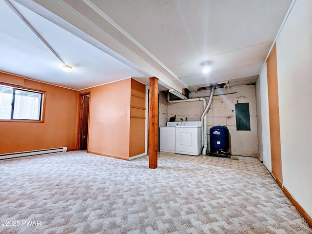 basement featuring washer and dryer, a baseboard heating unit, light carpet, and electric panel