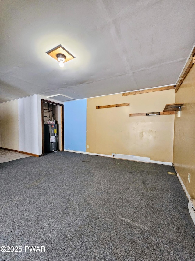 basement with carpet floors and water heater