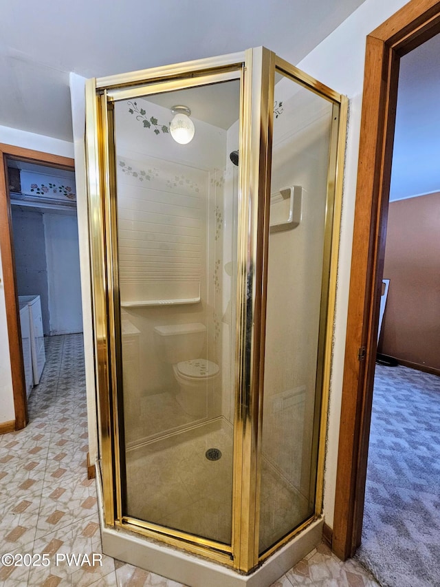 bathroom featuring a shower with door