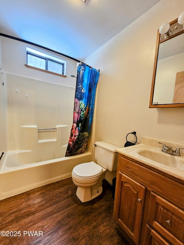 full bathroom featuring wood-type flooring, toilet, vanity, and shower / bath combo