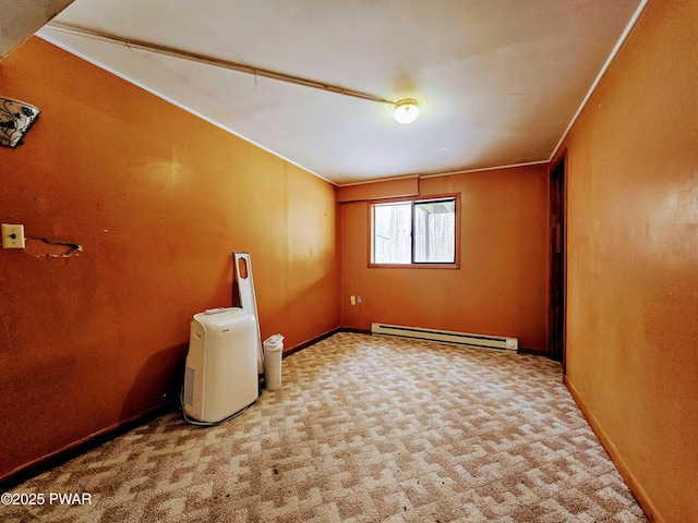 carpeted empty room with baseboard heating