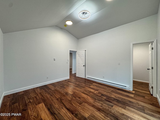 unfurnished bedroom with baseboard heating, dark wood-type flooring, lofted ceiling, and baseboards