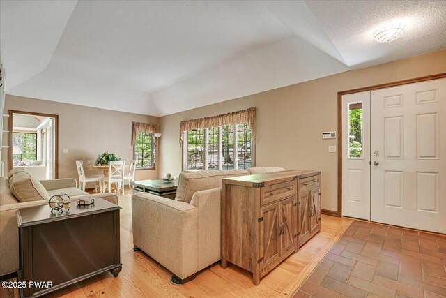 146 Cove Point Cir, Lakeville, PA 18438 - living room featuring lofted ceiling