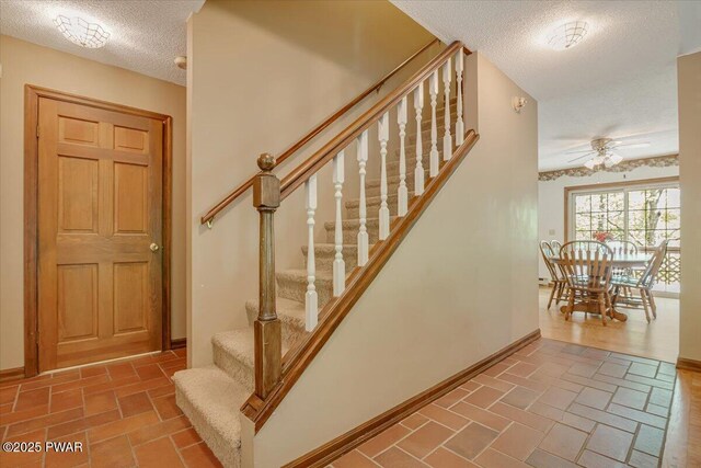 146 Cove Point Cir, Lakeville, PA 18438 - stairway with a textured ceiling, ceiling fan, and baseboards