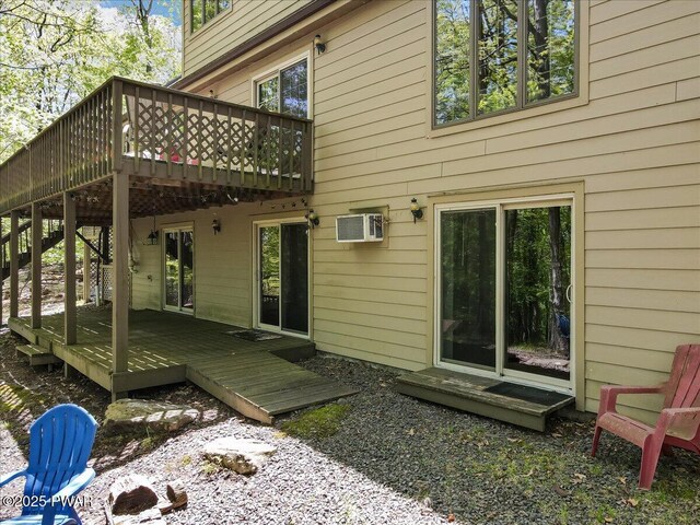 146 Cove Point Cir, Lakeville, PA 18438 - rear view of property with a wooden deck and a wall unit AC