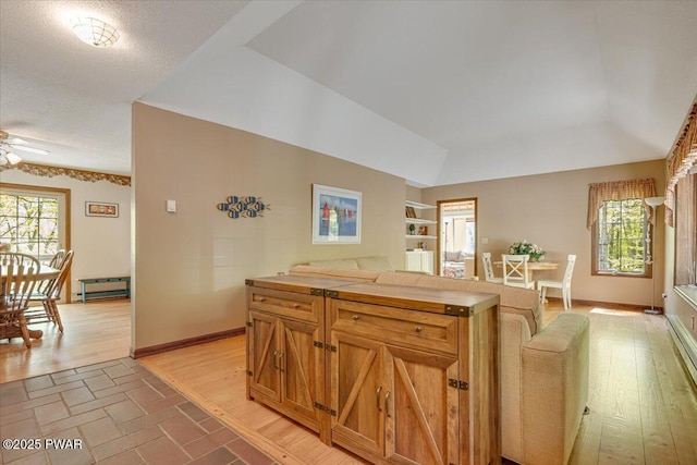 146 Cove Point Cir, Lakeville, PA 18438 - kitchen with a ceiling fan, open floor plan, baseboards, light countertops, and built in features