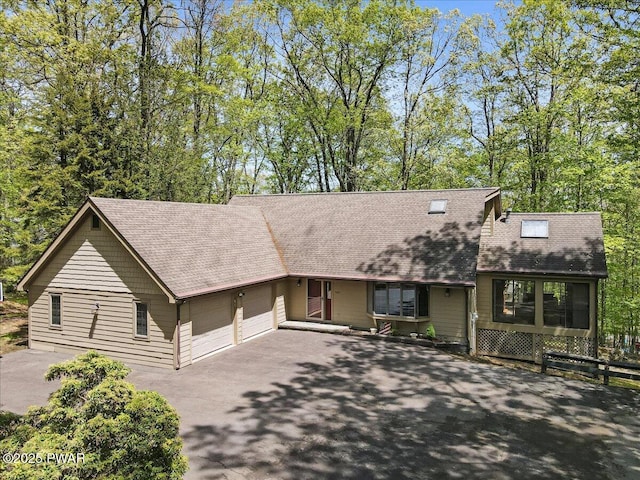 146 Cove Point Cir, Lakeville, PA 18438 - view of front of house with asphalt driveway, a garage, and a shingled roof