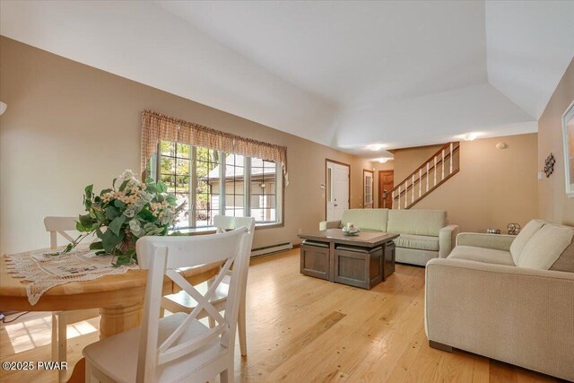 146 Cove Point Cir, Lakeville, PA 18438 - living room featuring light wood-style floors, a baseboard radiator, stairway, and a raised ceiling