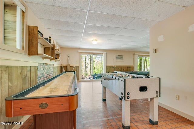 146 Cove Point Cir, Lakeville, PA 18438 - game room with a drop ceiling, plenty of natural light, wainscoting, and wooden walls