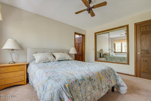146 Cove Point Cir, Lakeville, PA 18438 - bedroom with carpet flooring, a closet, a ceiling fan, and a textured ceiling