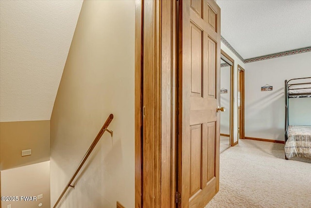 146 Cove Point Cir, Lakeville, PA 18438 - corridor featuring an upstairs landing, light carpet, a textured ceiling, and baseboards