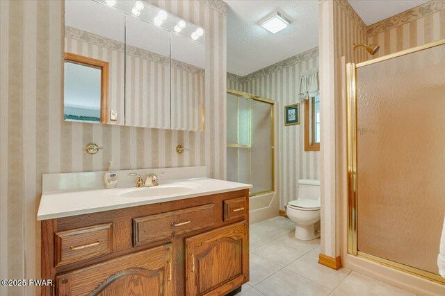146 Cove Point Cir, Lakeville, PA 18438 - bathroom with wallpapered walls, toilet, tile patterned flooring, vanity, and shower / bath combination with glass door