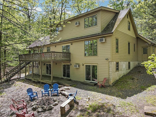 146 Cove Point Cir, Lakeville, PA 18438 - back of house with an outdoor fire pit, stairway, a deck, and a wall mounted AC