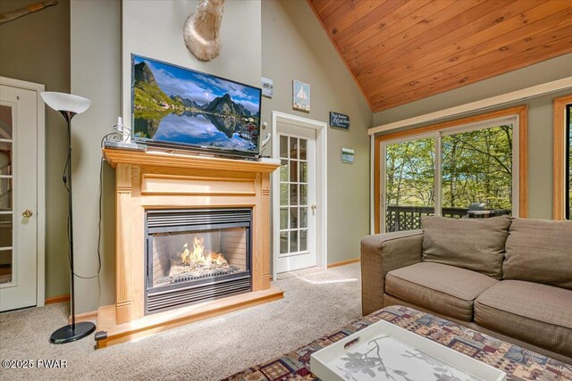 146 Cove Point Cir, Lakeville, PA 18438 - carpeted living room with a glass covered fireplace, wood ceiling, baseboards, and high vaulted ceiling
