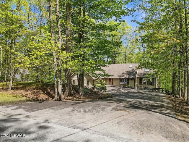 146 Cove Point Cir, Lakeville, PA 18438 - view of front of house with driveway and a shingled roof