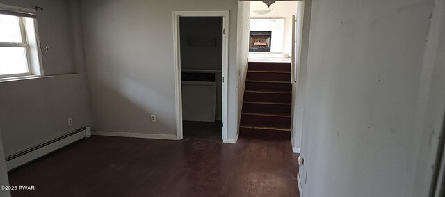 171 Flatbrook Way, Milford, PA 18337 - empty room featuring baseboards, dark wood-style flooring, a fireplace, baseboard heating, and stairs