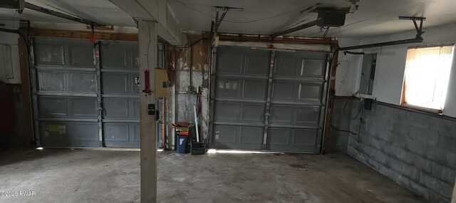 171 Flatbrook Way, Milford, PA 18337 - garage with concrete block wall, a garage door opener, and electric panel