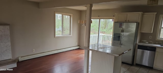 171 Flatbrook Way, Milford, PA 18337 - kitchen featuring tile countertops, decorative columns, white cabinets, stainless steel appliances, and a baseboard radiator