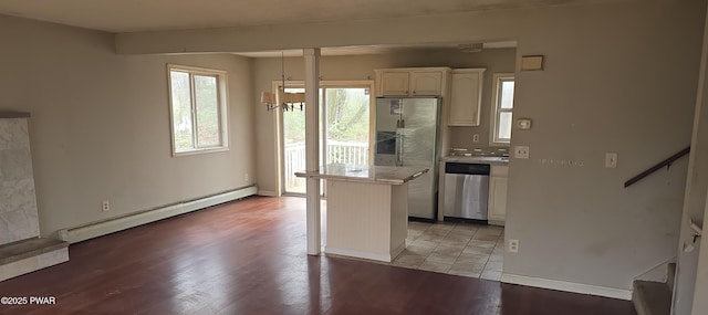 171 Flatbrook Way, Milford, PA 18337 - kitchen with a center island, white cabinetry, light wood-style floors, stainless steel appliances, and a baseboard radiator
