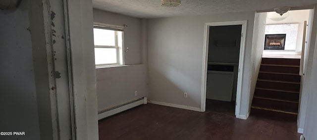 171 Flatbrook Way, Milford, PA 18337 - interior space featuring a textured ceiling, a closet, baseboard heating, dark wood-style flooring, and baseboards