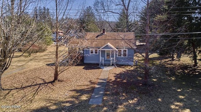 view of front of home featuring roof with shingles