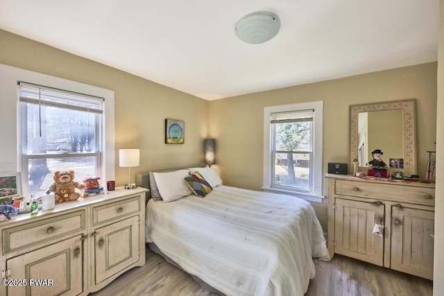 bedroom with light wood-style floors