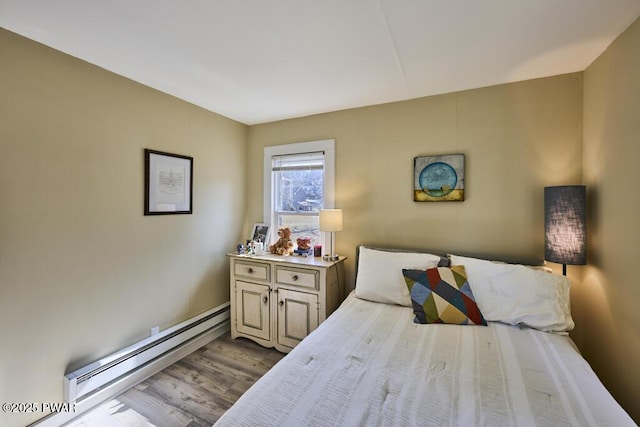 bedroom featuring a baseboard radiator and dark wood-style flooring