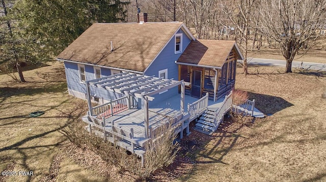 exterior space featuring a chimney, stairway, a pergola, and a shingled roof