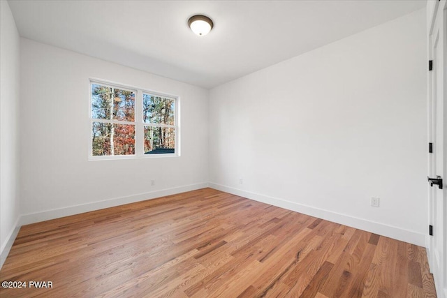 unfurnished room with light hardwood / wood-style floors