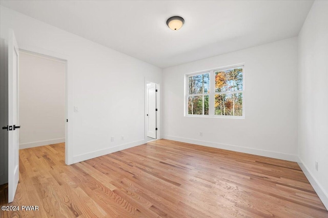 spare room with light wood-type flooring