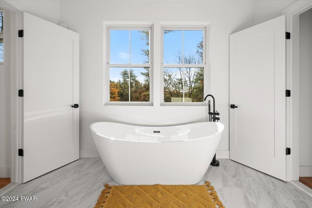 bathroom with a washtub