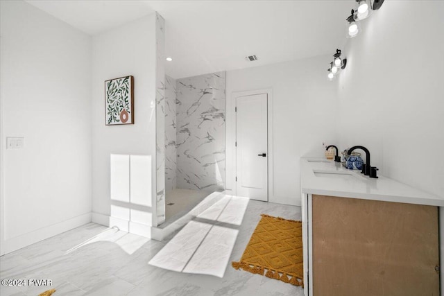 bathroom with vanity and walk in shower