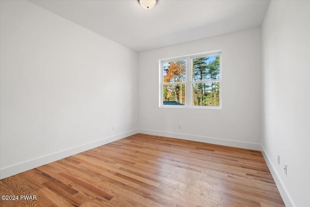 unfurnished room featuring light hardwood / wood-style flooring