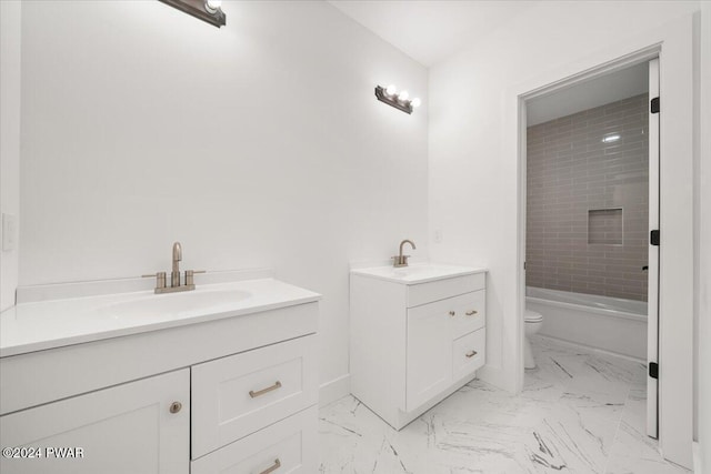 full bathroom featuring vanity, toilet, and tiled shower / bath combo