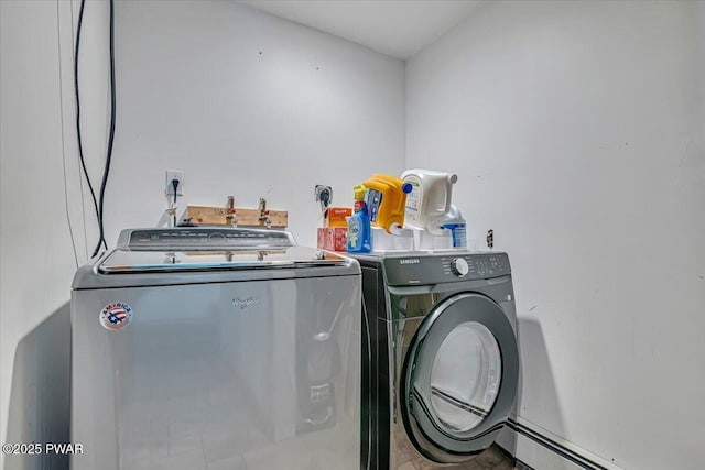 laundry room featuring washing machine and dryer and a baseboard radiator