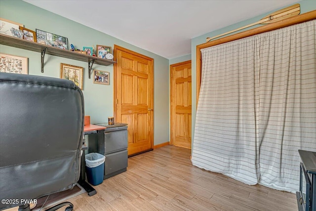 office with light hardwood / wood-style flooring