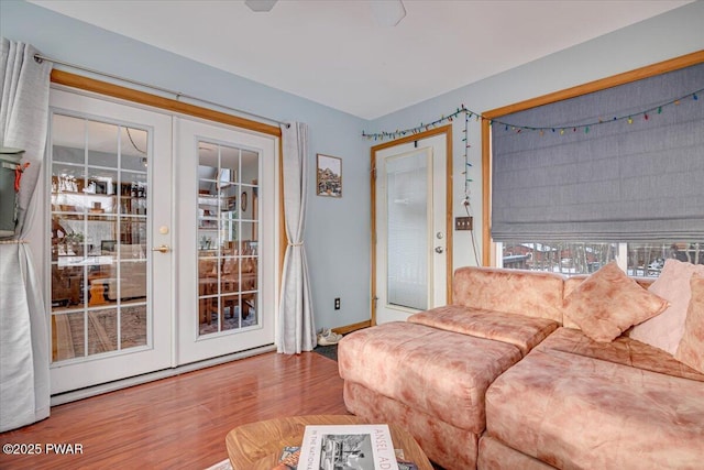 living room with french doors and hardwood / wood-style flooring