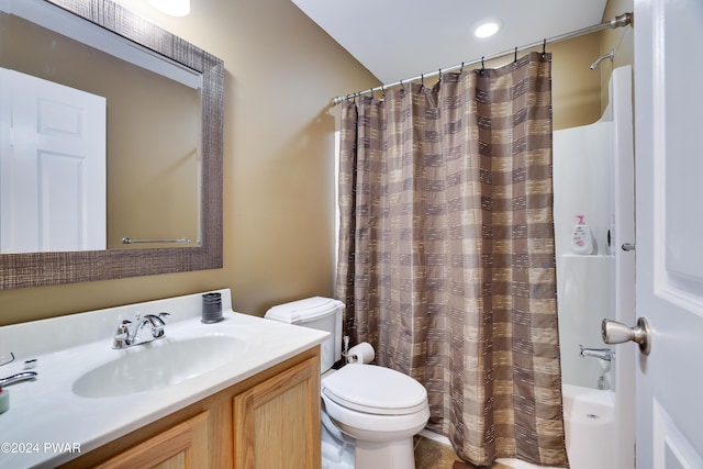 full bathroom featuring shower / bath combination with curtain, toilet, vanity, and vaulted ceiling