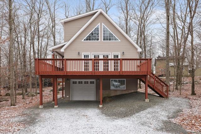 exterior space with a garage and a deck