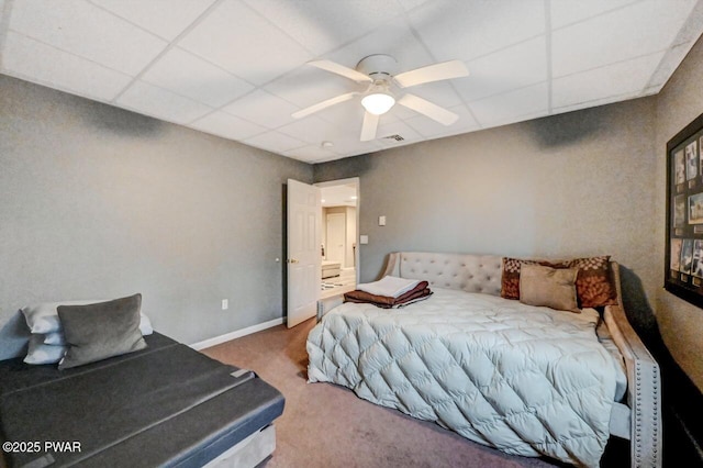 bedroom with a paneled ceiling, carpet flooring, visible vents, and baseboards