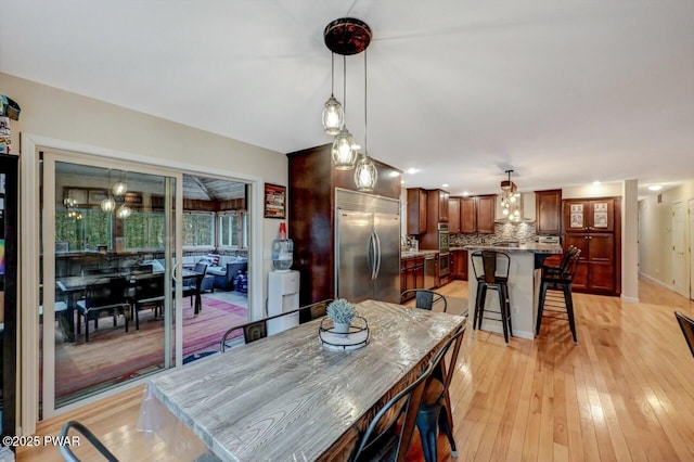 dining room with light wood-style flooring