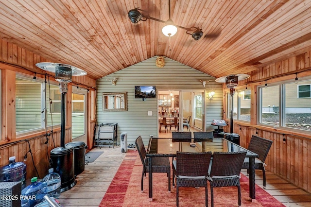 sunroom with lofted ceiling and wooden ceiling