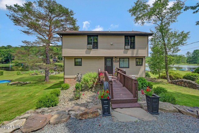 29 Tanglewood Ln, Lake Ariel, PA 18436 - colonial-style house featuring a front lawn and a water view