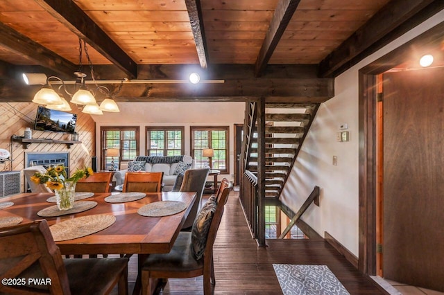 29 Tanglewood Ln, Lake Ariel, PA 18436 - dining room with wood finished floors, a wooden ceiling with exposed beams, a glass covered fireplace, a chandelier, and stairs