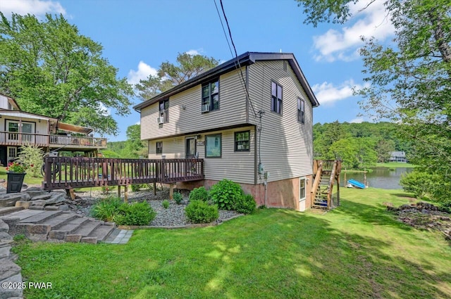 29 Tanglewood Ln, Lake Ariel, PA 18436 - back of property with a deck with water view and a yard