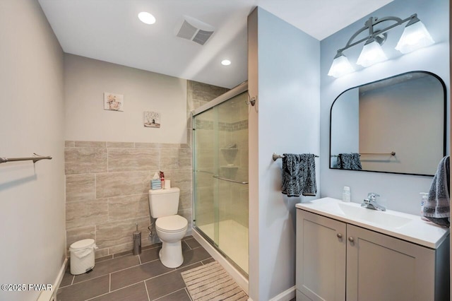 29 Tanglewood Ln, Lake Ariel, PA 18436 - bathroom with tile walls, tile patterned flooring, a stall shower, vanity, and recessed lighting