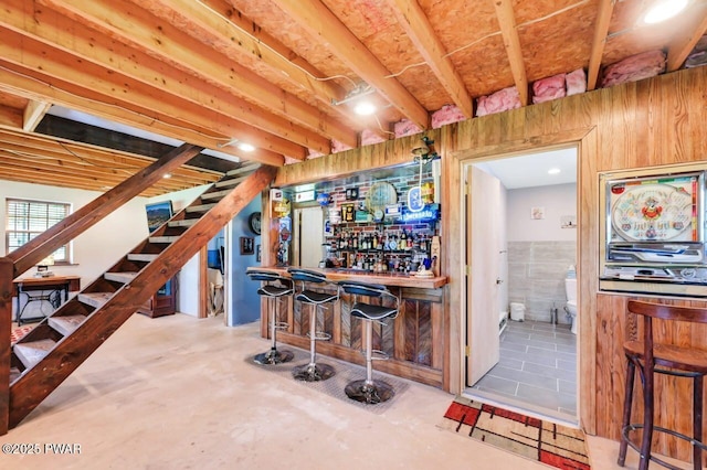 29 Tanglewood Ln, Lake Ariel, PA 18436 - indoor dry bar with stairway and concrete flooring