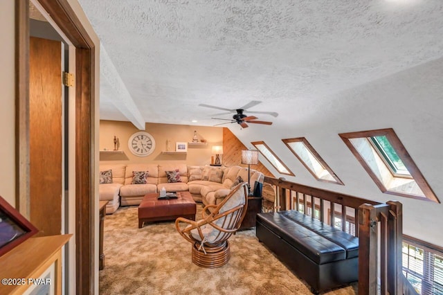29 Tanglewood Ln, Lake Ariel, PA 18436 - carpeted living room featuring a textured ceiling, a skylight, ceiling fan, and lofted ceiling