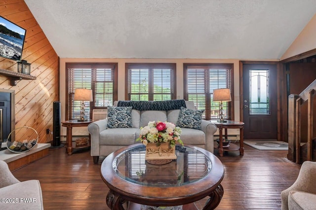 29 Tanglewood Ln, Lake Ariel, PA 18436 - living area featuring vaulted ceiling, wooden walls, a textured ceiling, and wood-type flooring
