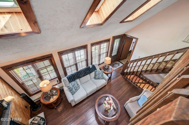 29 Tanglewood Ln, Lake Ariel, PA 18436 - living room featuring vaulted ceiling, wood finished floors, plenty of natural light, and a skylight